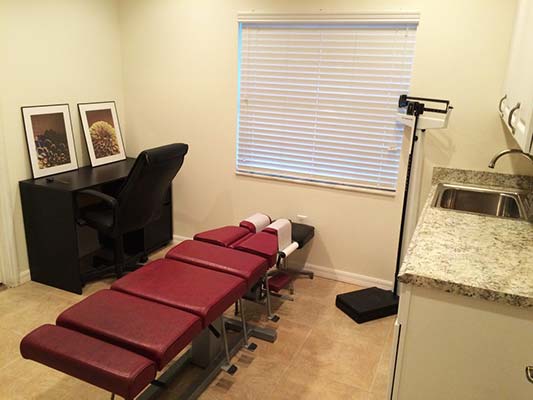 Chiropractic Trinity FL Red Adjustment Table